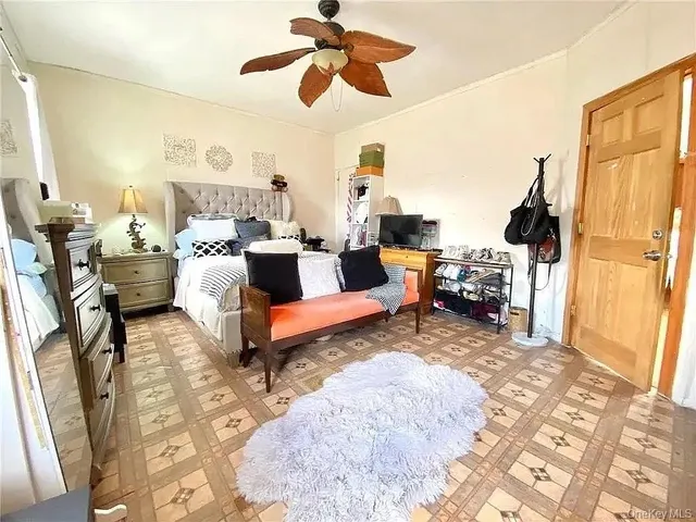 a living room with fireplace furniture and a rug