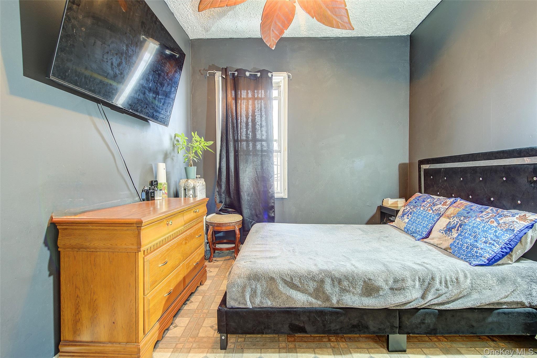 9 Adler Place Brooklyn, NY 11208 - Photo 13 of 19 a bedroom with a bed and a night stand