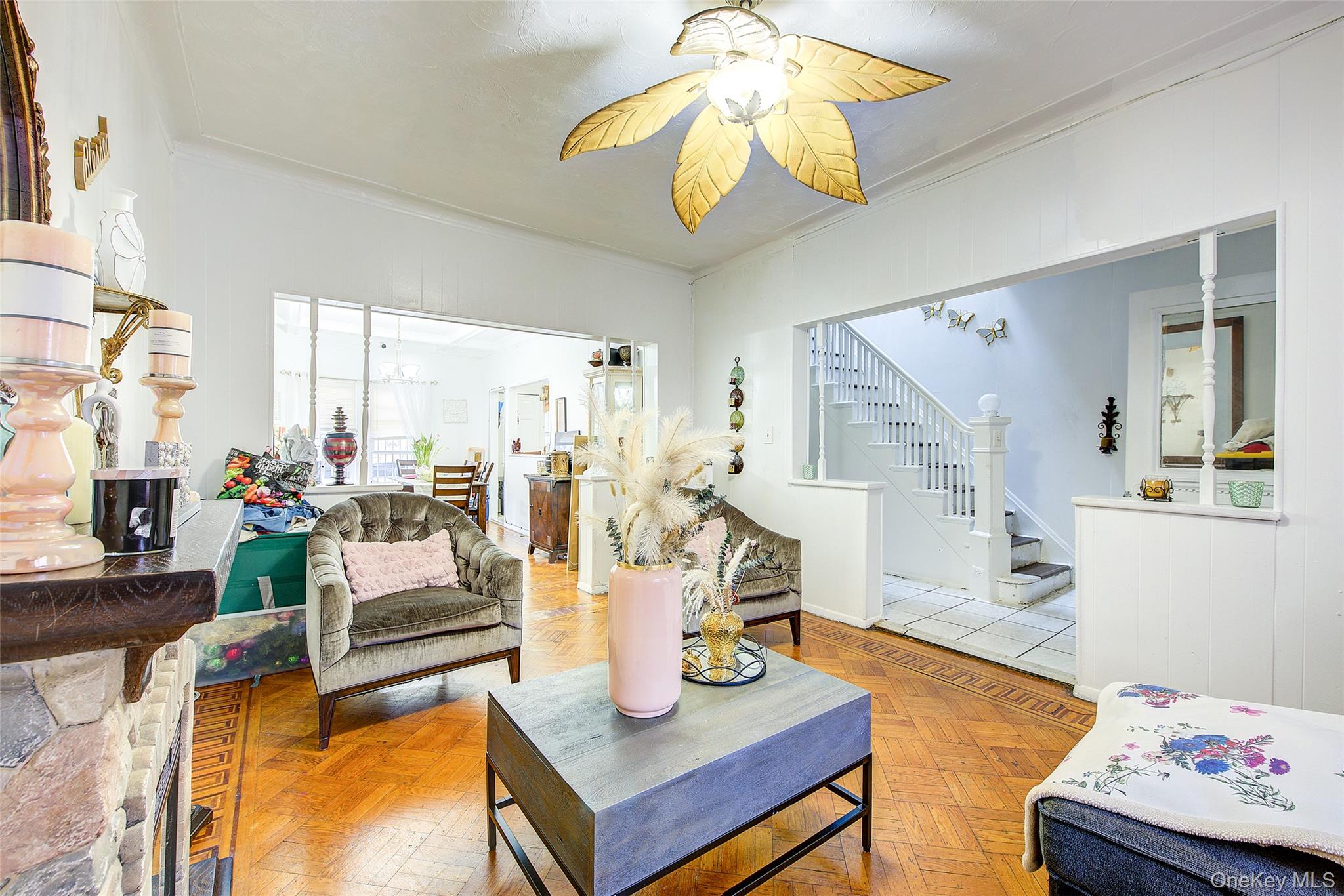 9 Adler Place Brooklyn, NY 11208 - Photo 4 of 19 a living room with furniture and a chandelier