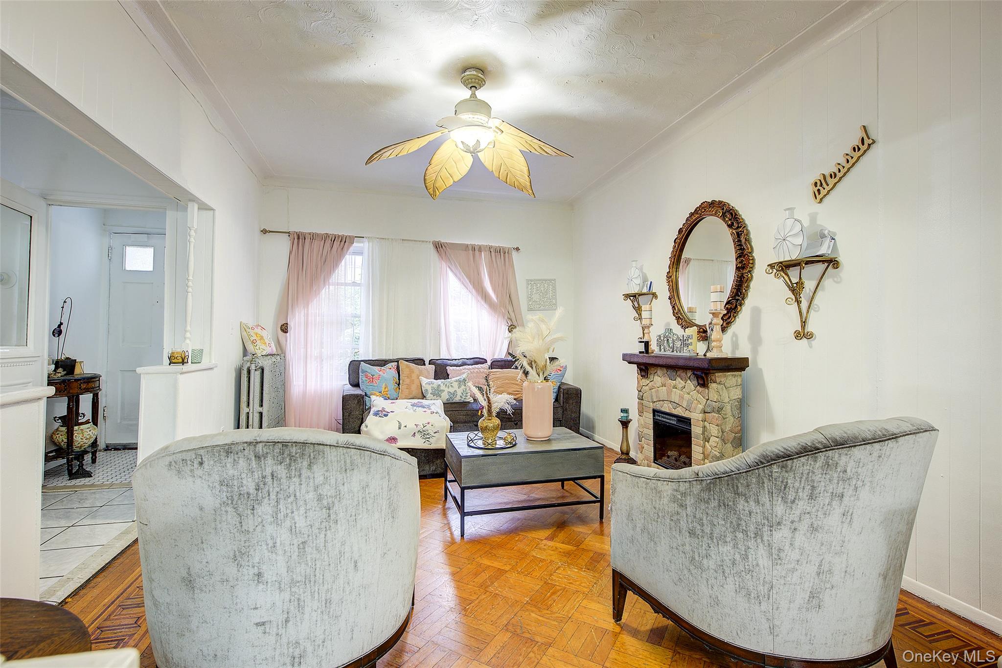 9 Adler Place Brooklyn, NY 11208 - Photo 5 of 19 a living room with furniture and a fireplace