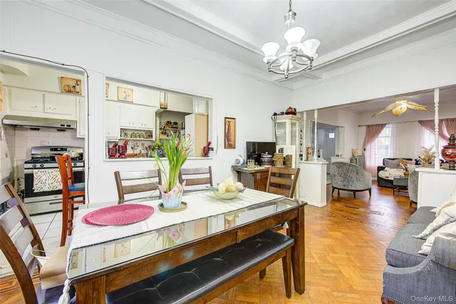 a living room with dining table and chairs
