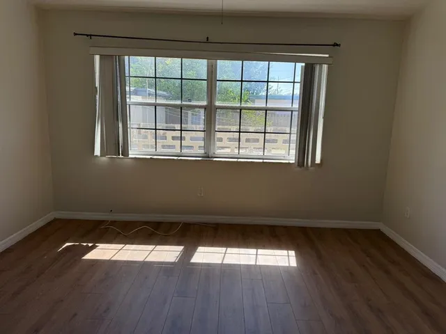 a bathroom with a shower a toilet and sink