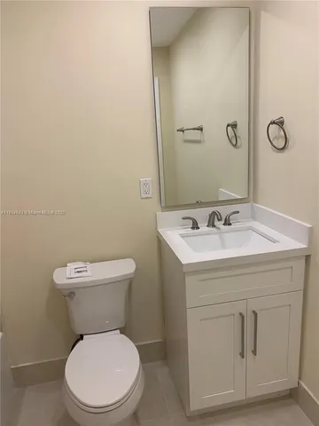 a bathroom with a shower and a toilet
