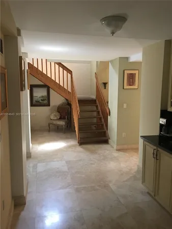 a view of entryway with stairs and furniture