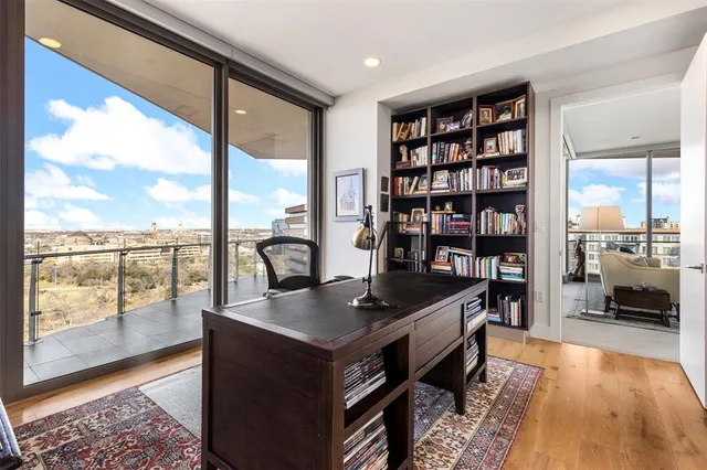 a view of a workspace with bookshelf