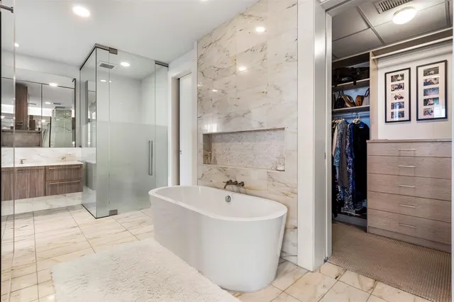 a bathroom with a bathtub and a sink