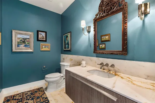 a bedroom with furniture and a large window