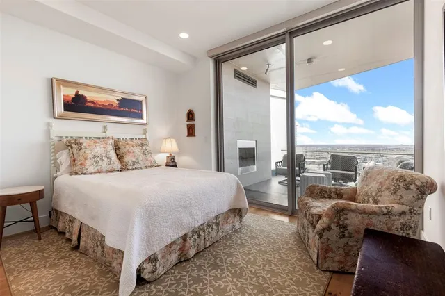 a bathroom with a granite countertop sink a toilet and a mirror