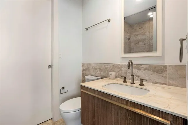 a view of washer and dryer with kitchen in the background