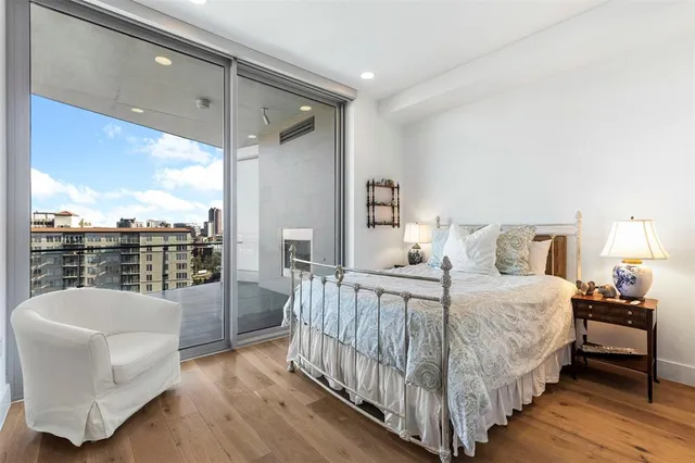 a bathroom with a granite countertop sink a toilet and a mirror