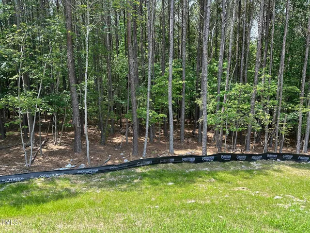 a view of a backyard with swimming pool