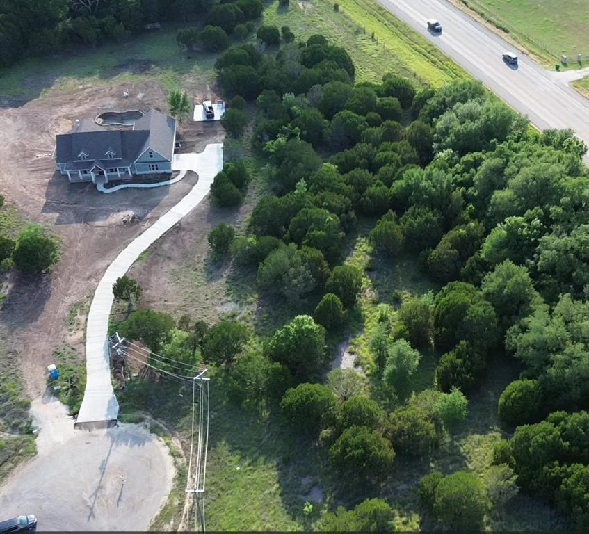 1129 County Road Nemo, TX 76070 - Photo 3 of 29 a aerial view of a house with a yard and trees