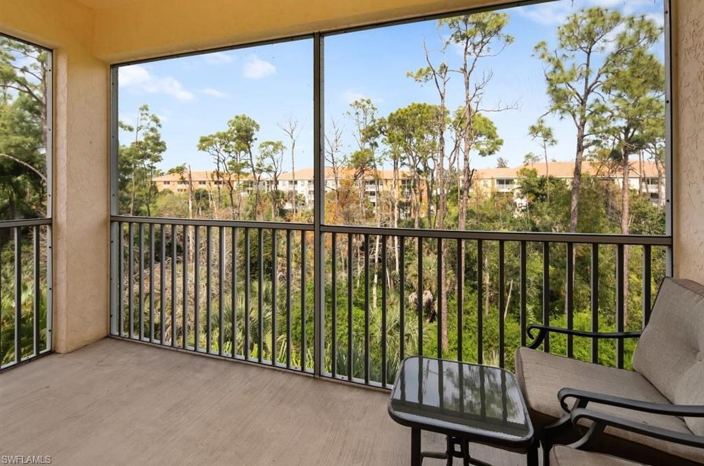 4510 Botanical Pl Circle, Unit 402 Naples, FL 34112 - Photo 4 of 15 a view of a balcony with furniture