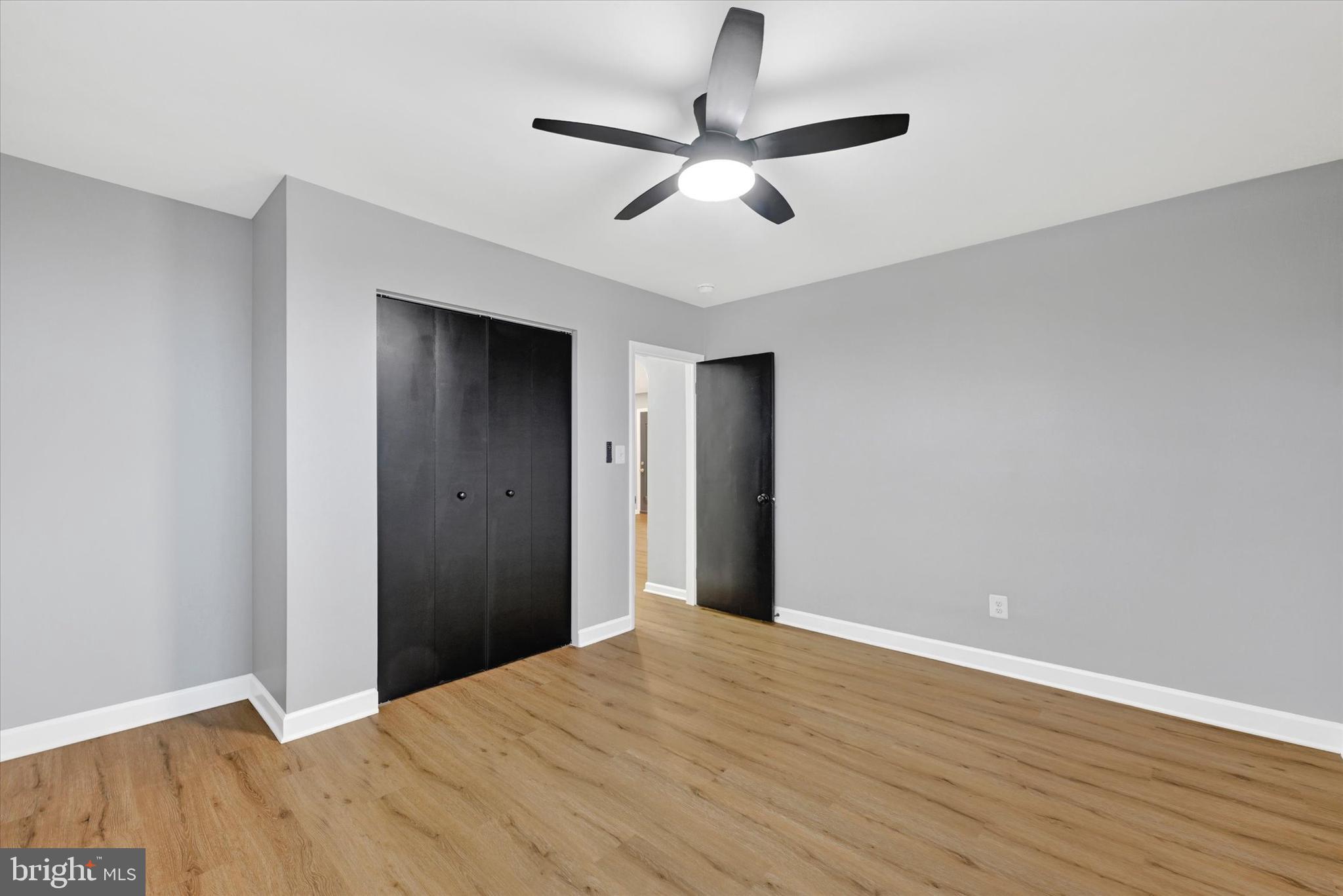 1214 South 48th Street Baltimore, MD 21222 - Photo 20 of 38 a view of empty room with wooden floor