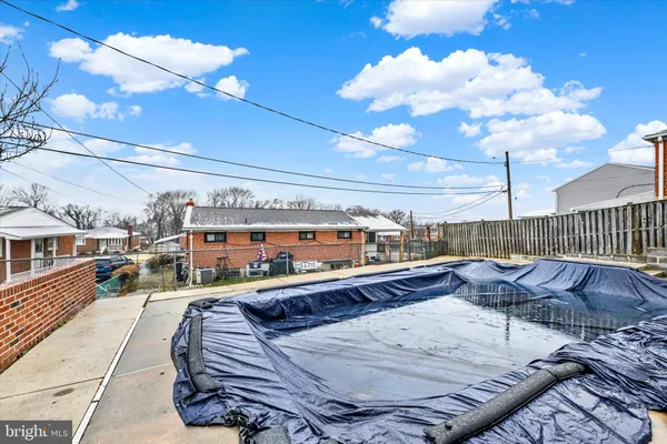 a balcony with furniture and city view