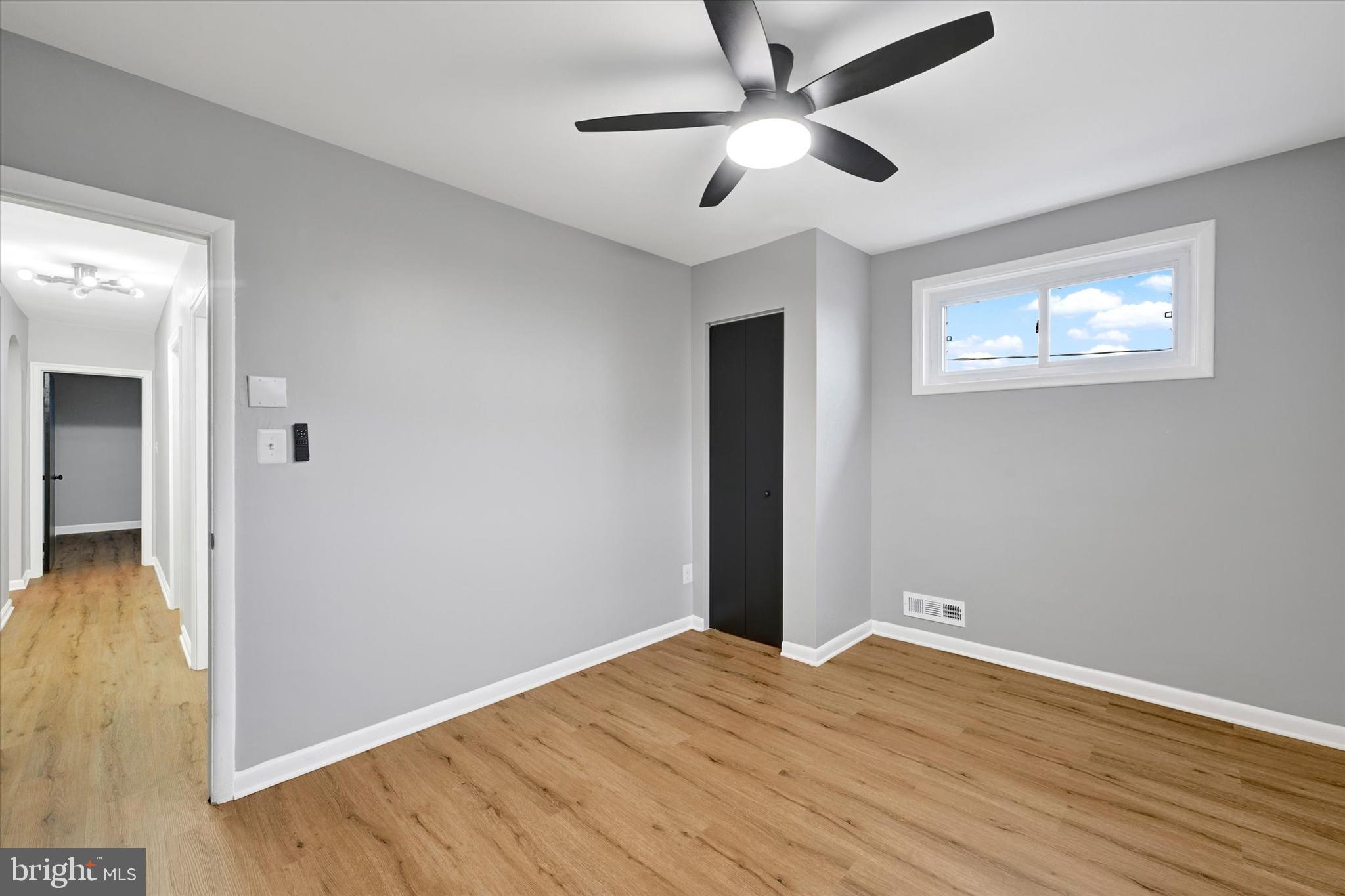 1214 South 48th Street Baltimore, MD 21222 - Photo 24 of 38 a view of empty room with wooden floor