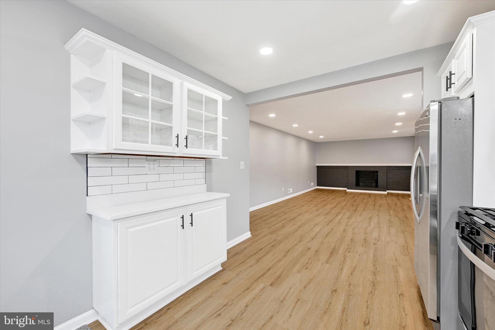 1214 South 48th Street Baltimore, MD 21222 - Photo 27 of 38 a open kitchen with a sink and wooden floor
