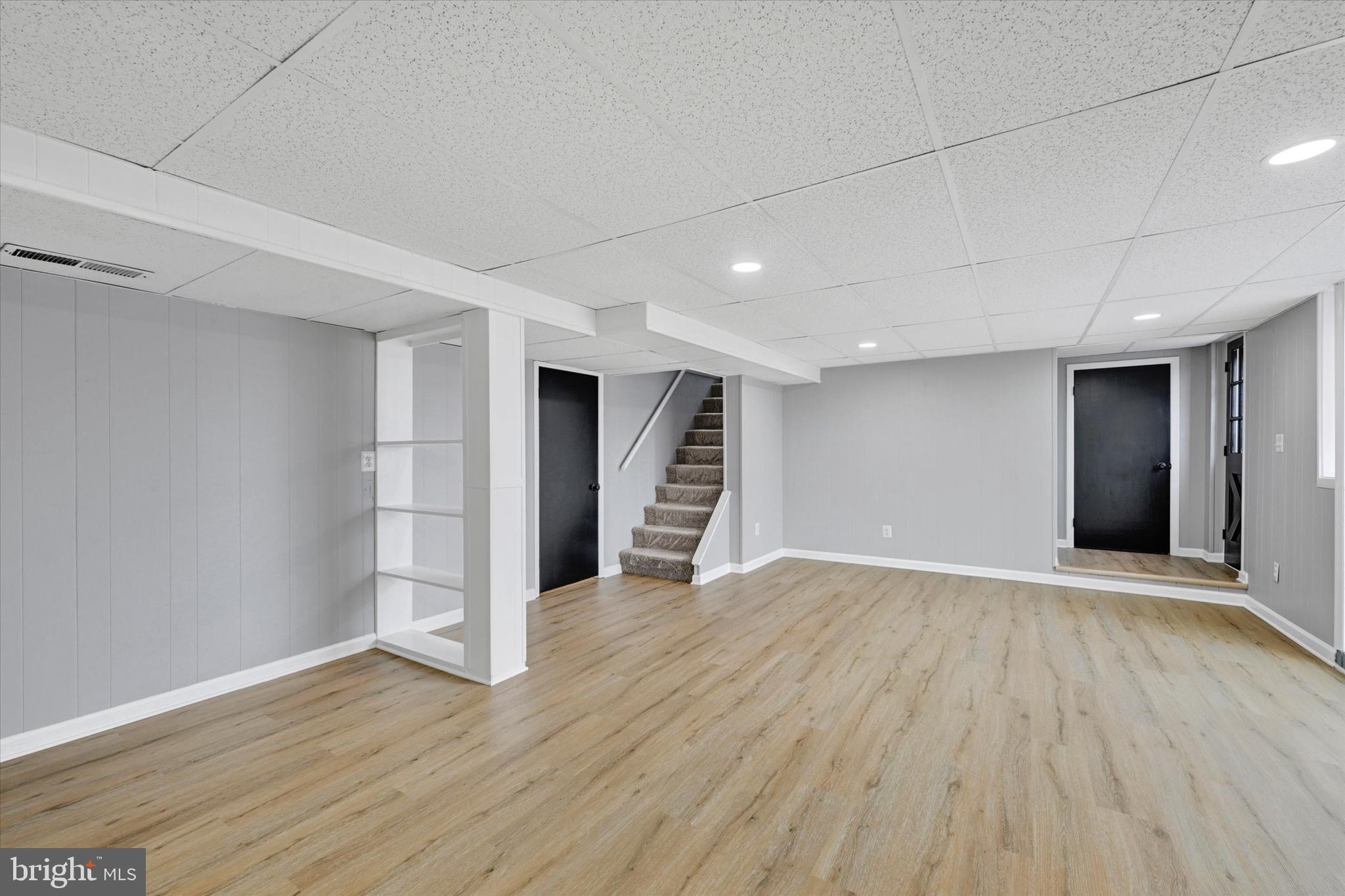 1214 South 48th Street Baltimore, MD 21222 - Photo 31 of 38 a view of an empty room with wooden floor and closet