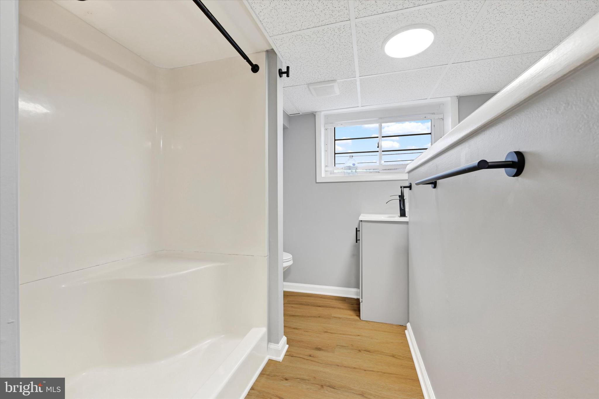 1214 South 48th Street Baltimore, MD 21222 - Photo 32 of 38 a bathroom with a bathtub and shower