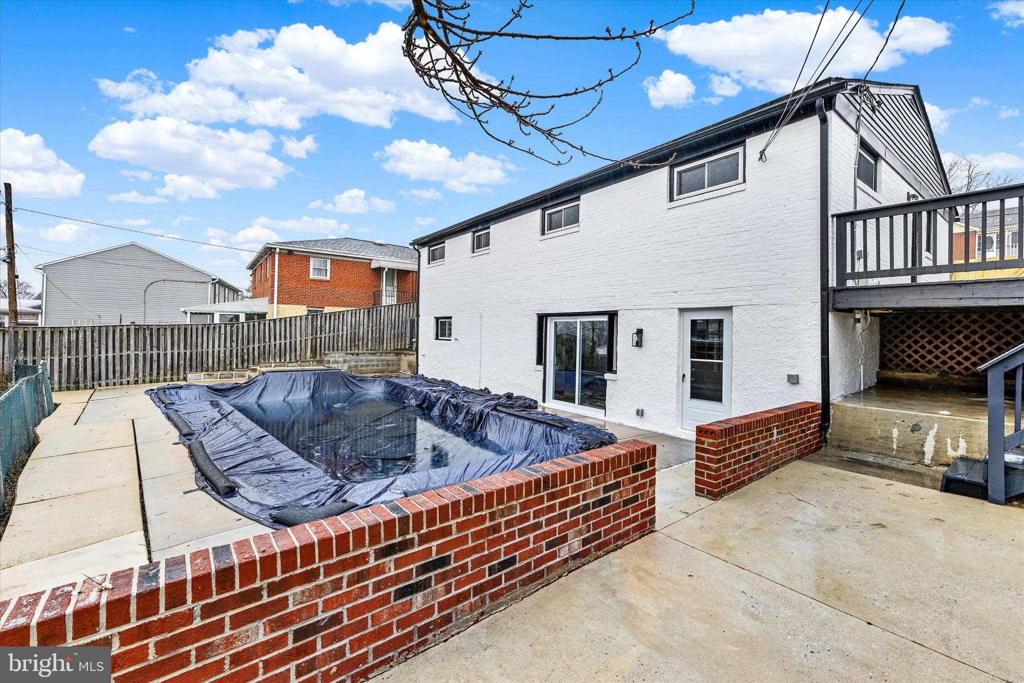 1214 South 48th Street Baltimore, MD 21222 - Photo 34 of 38 a view of barbeque area with wooden fence