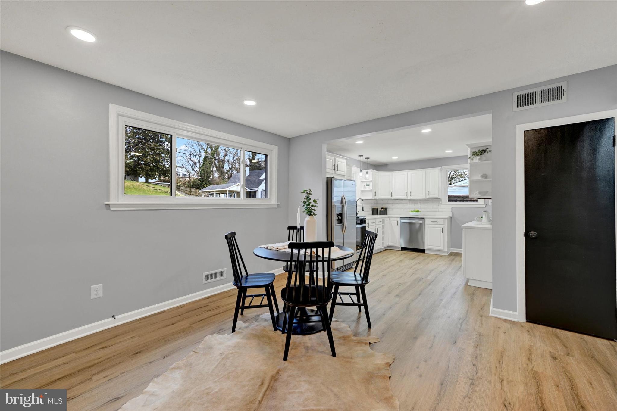 1214 South 48th Street Baltimore, MD 21222 - Photo 8 of 38 a view of a dining room with furniture