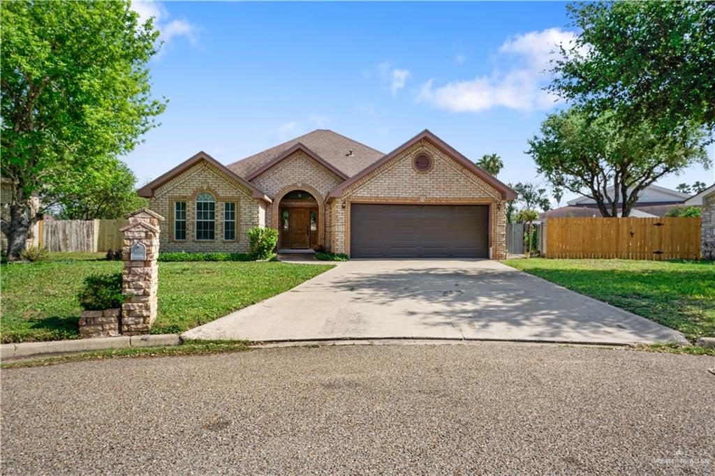 5800 North 29th Lane McAllen, TX 78504 - Photo 1 of 11 a front view of a house with a yard and garage