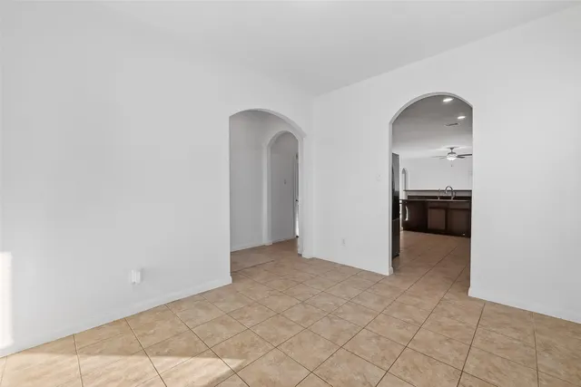 a large kitchen with stainless steel appliances granite countertop a stove a sink dishwasher and cabinets