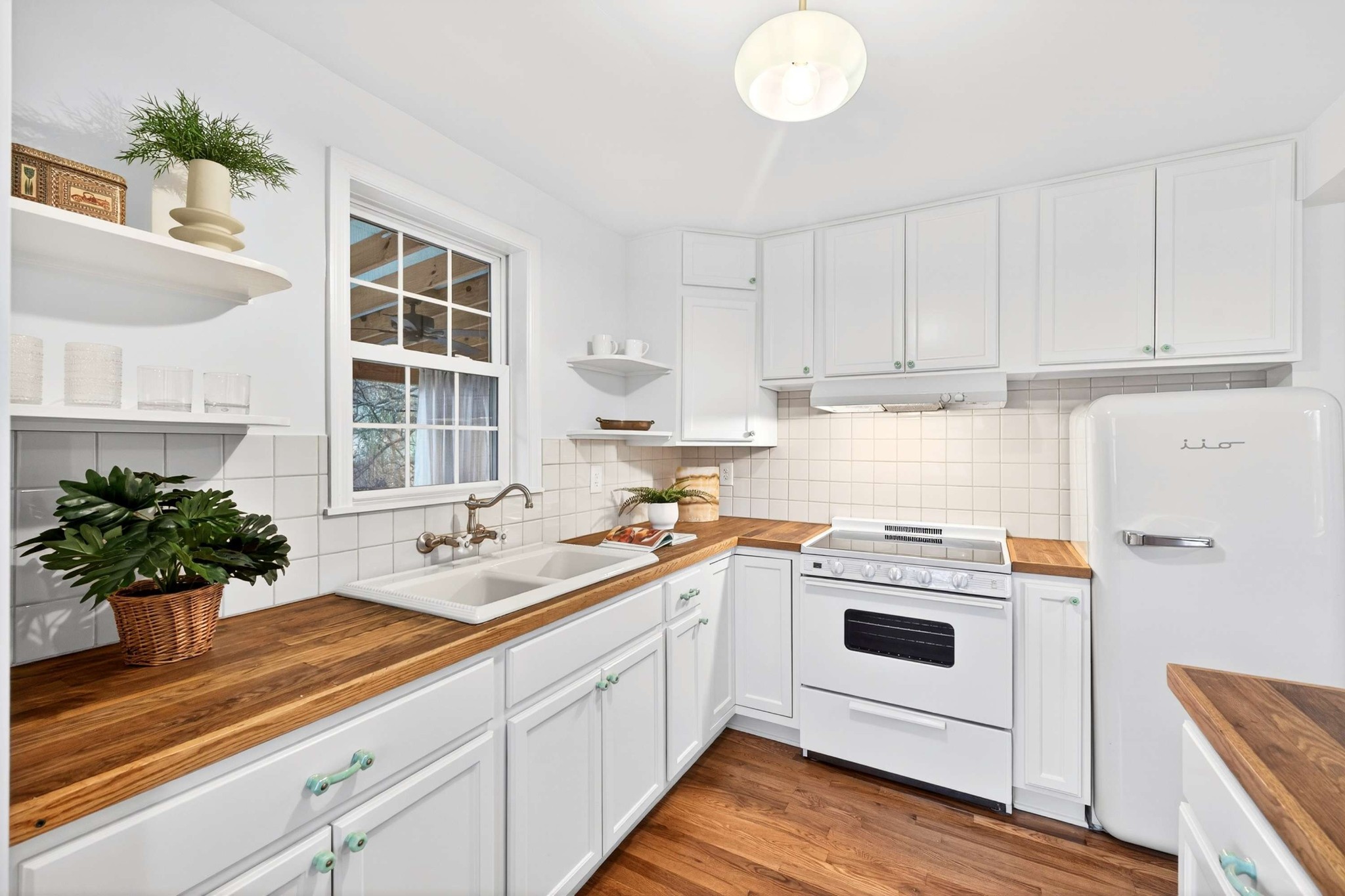 2017 Hackberry Lane Nashville, TN 37206 - Photo 13 of 36 a kitchen with a sink and white cabinets