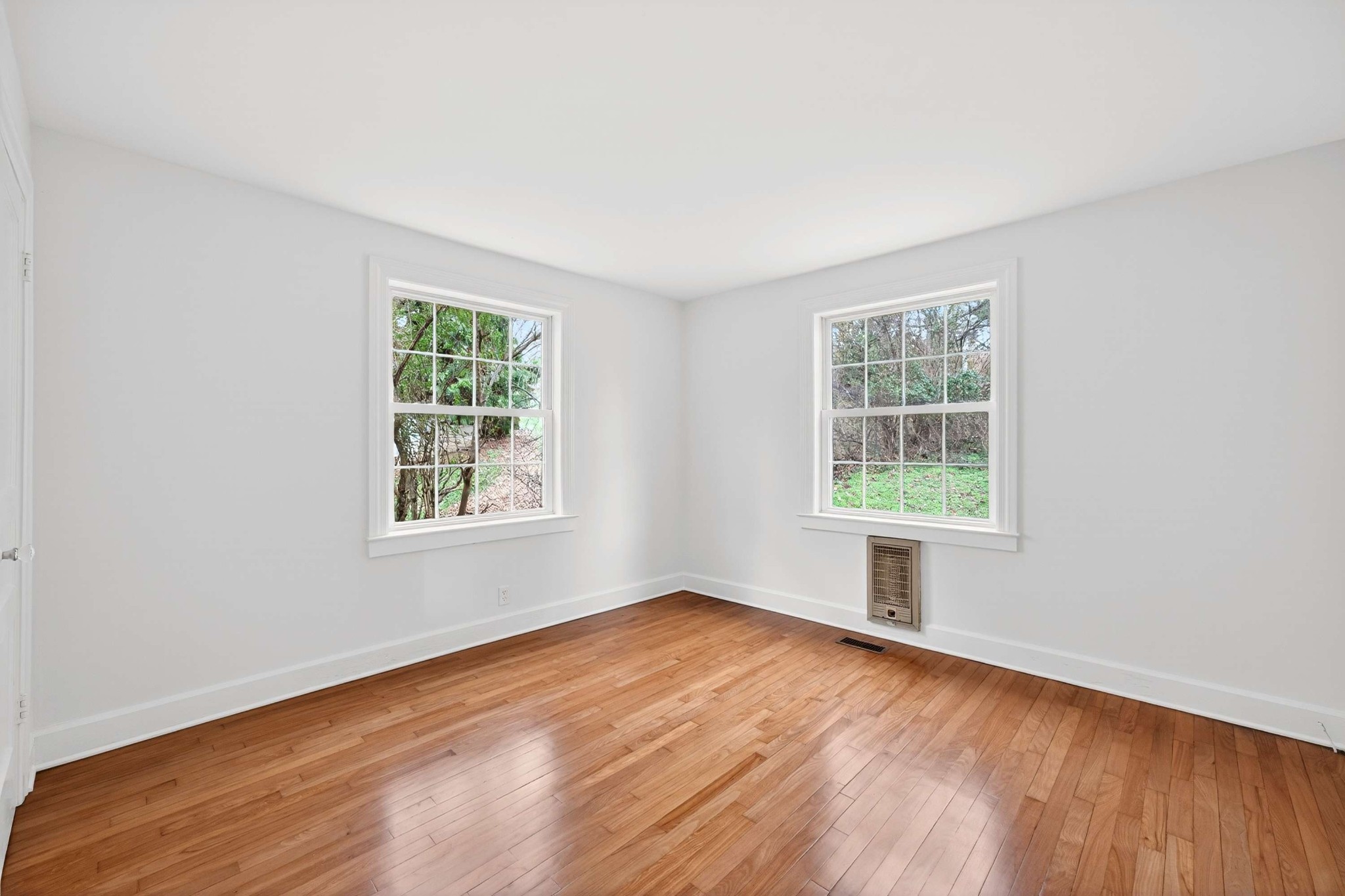 2017 Hackberry Lane Nashville, TN 37206 - Photo 16 of 36 an empty room with wooden floor and windows