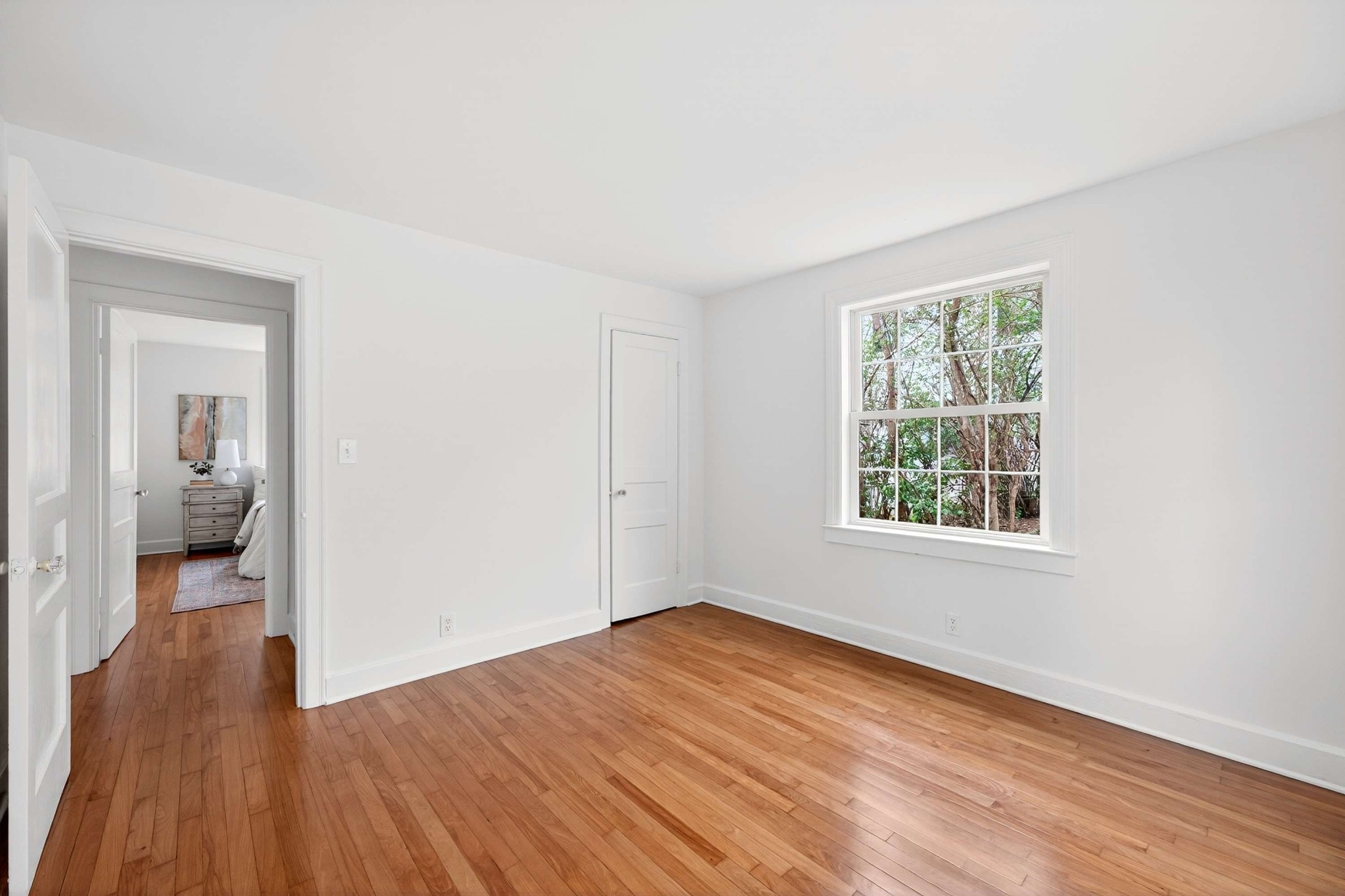 2017 Hackberry Lane Nashville, TN 37206 - Photo 17 of 36 an empty room with wooden floor and a window
