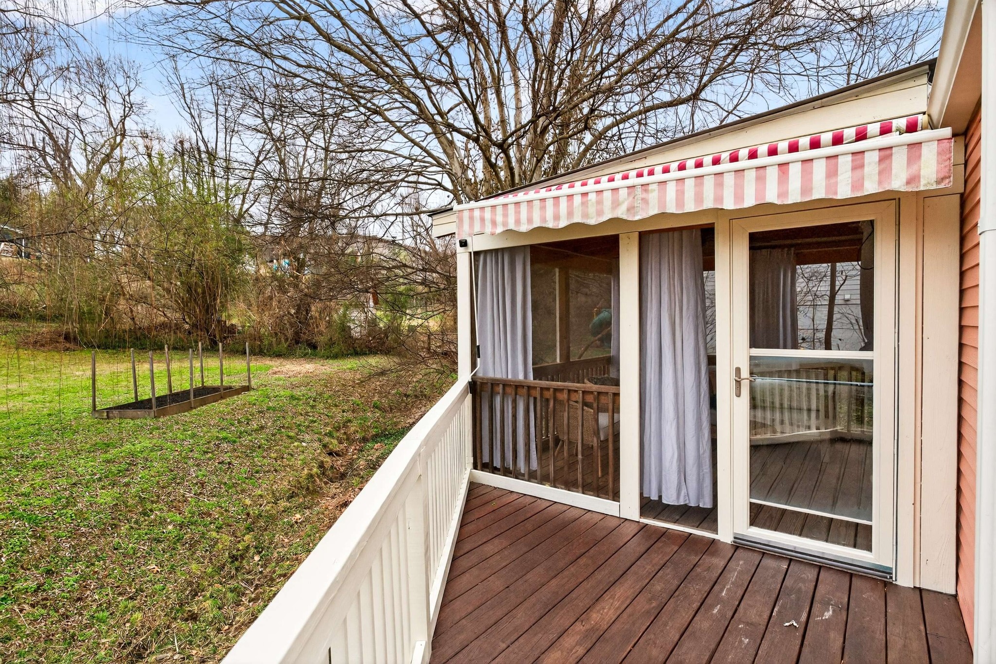 2017 Hackberry Lane Nashville, TN 37206 - Photo 21 of 36 a view of a house with a wooden deck