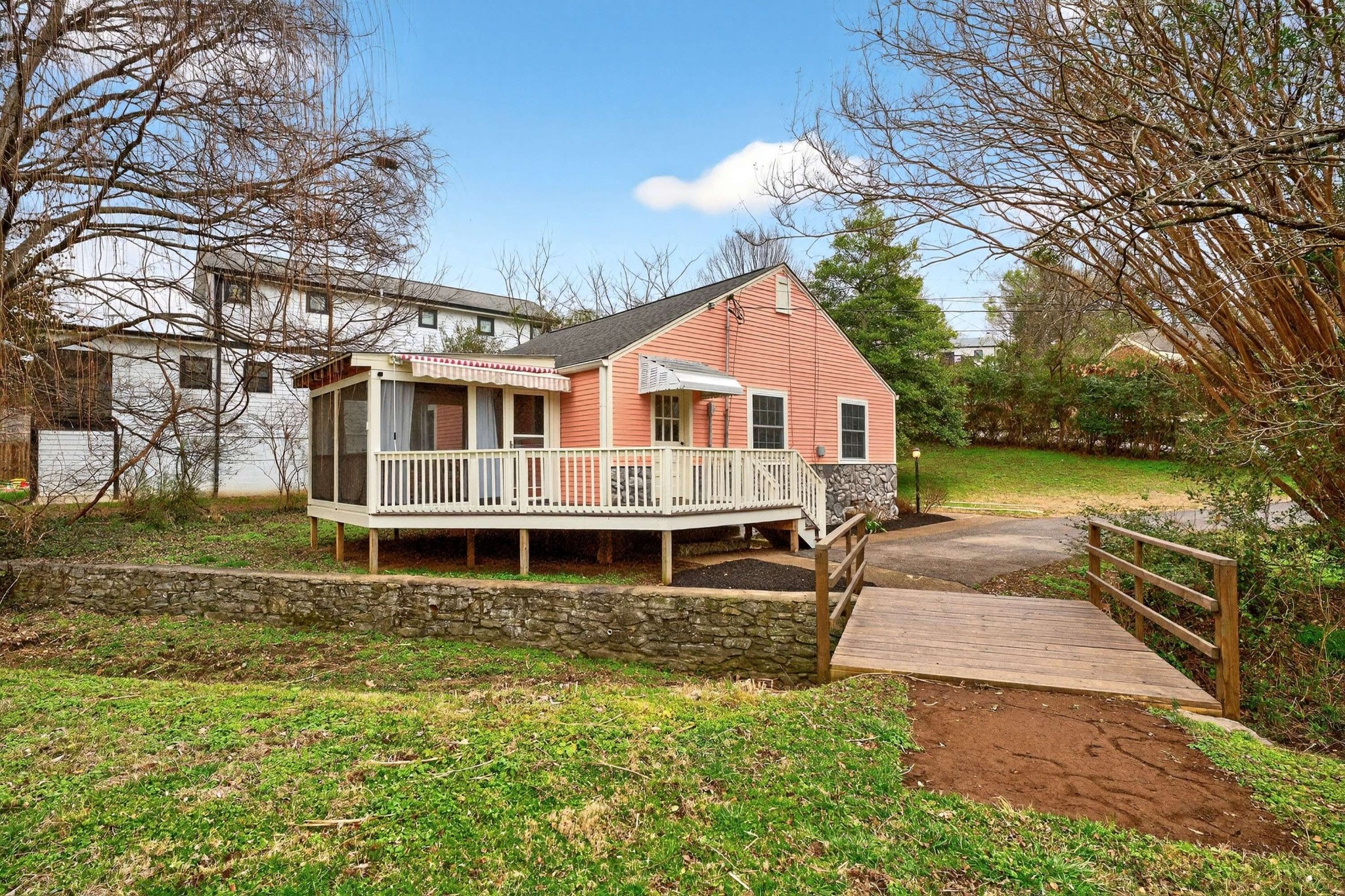 2017 Hackberry Lane Nashville, TN 37206 - Photo 24 of 36 a front view of a house with a yard table and chairs