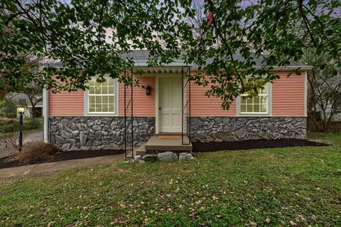 front view of a house with a yard