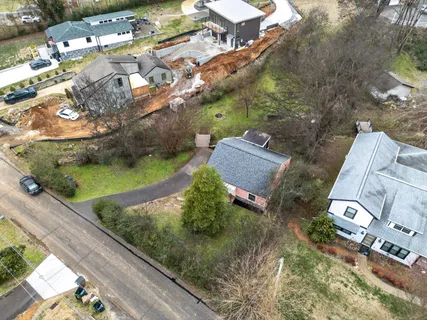 an aerial view of a house with a garden