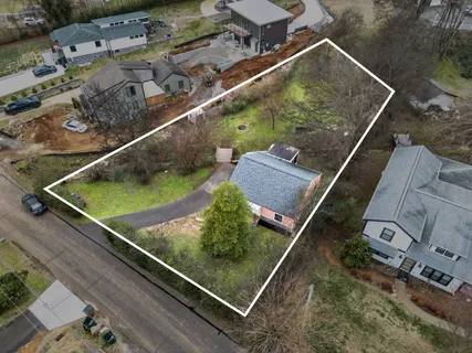 an aerial view of house with a pool