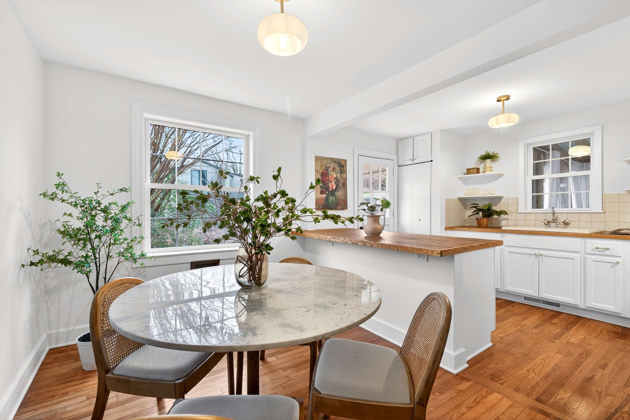 2017 Hackberry Lane Nashville, TN 37206 - Photo 8 of 36 a table and chairs in a kitchen
