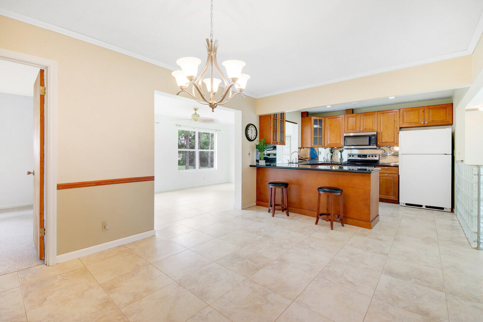 17575 Bridle Court Jupiter, FL 33478 - Photo 11 of 35 a kitchen with stainless steel appliances granite countertop a stove and refrigerator