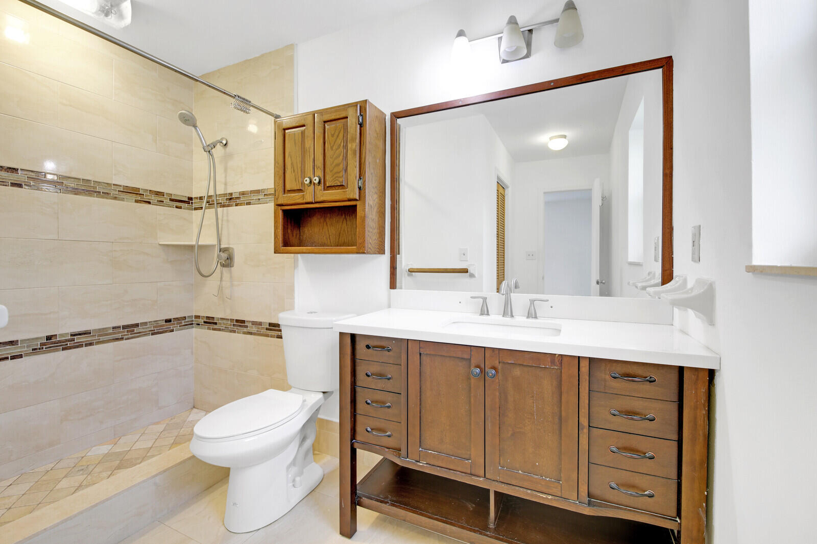 17575 Bridle Court Jupiter, FL 33478 - Photo 20 of 35 a bathroom with a granite countertop sink mirror vanity and toilet