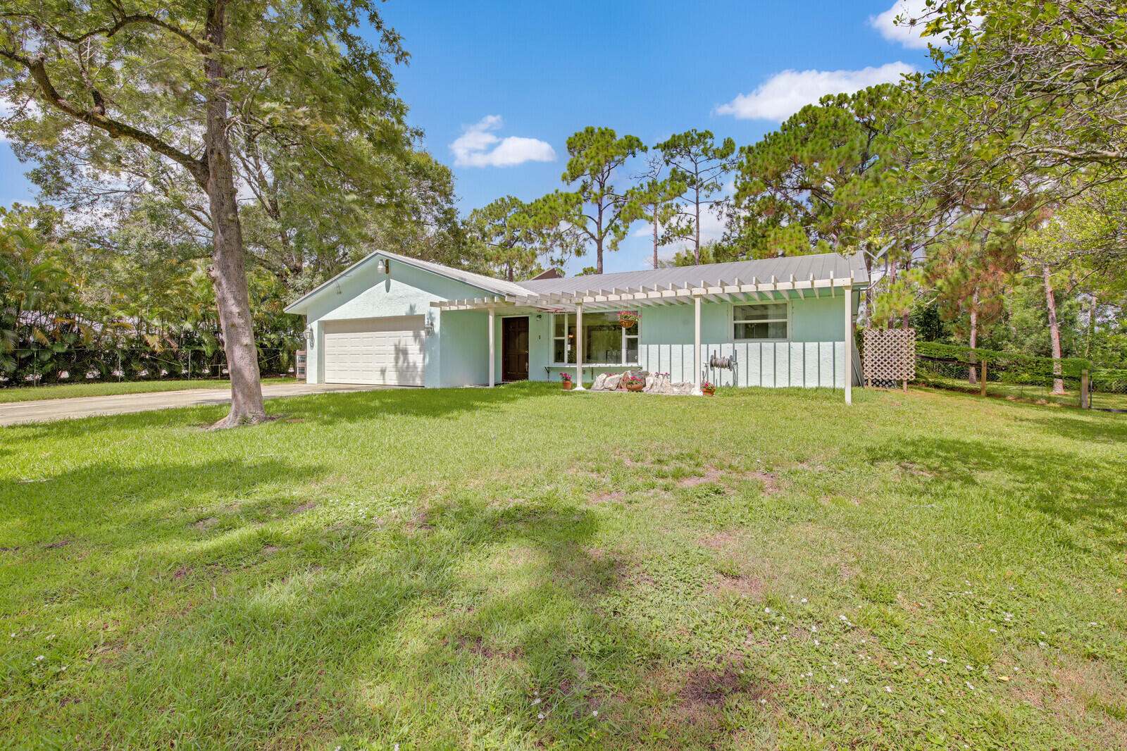 17575 Bridle Court Jupiter, FL 33478 - Photo 2 of 35 a view of a house with a big yard