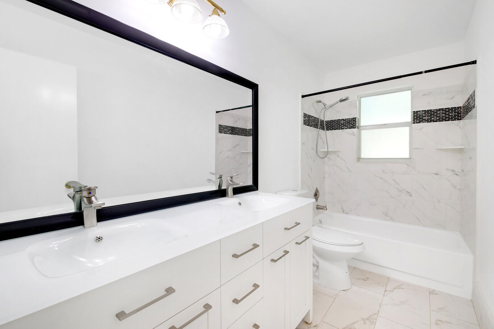 17575 Bridle Court Jupiter, FL 33478 - Photo 23 of 35 a bathroom with a granite countertop sink a toilet and shower