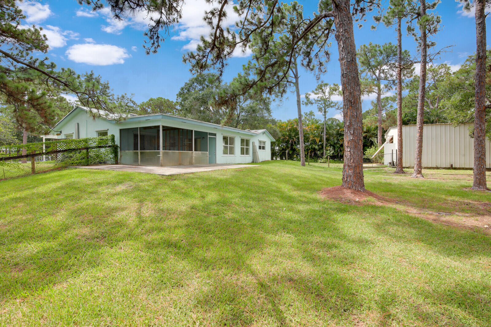 17575 Bridle Court Jupiter, FL 33478 - Photo 28 of 35 a view of a house with yard and tree s