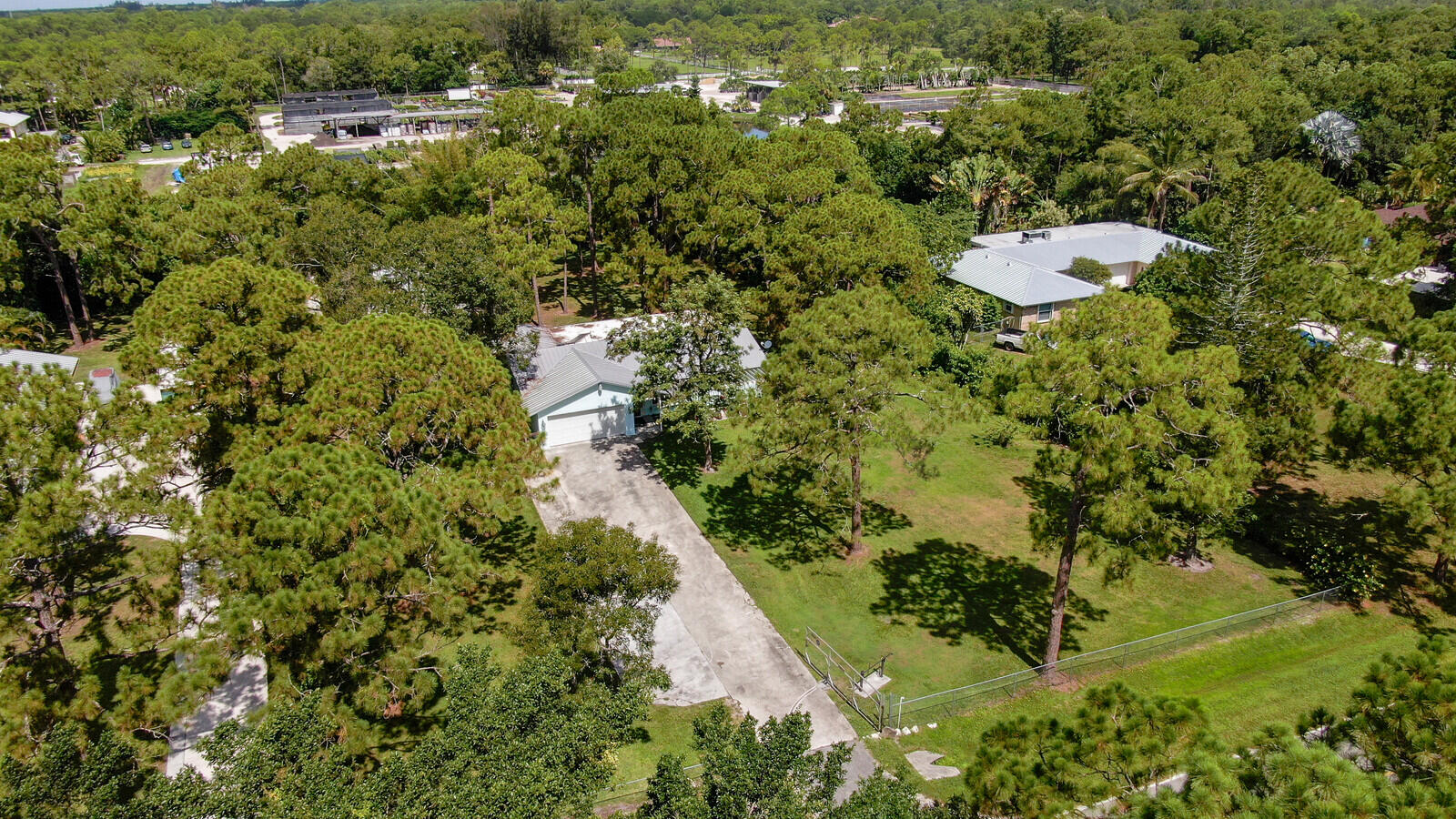 17575 Bridle Court Jupiter, FL 33478 - Photo 34 of 35 a backyard of a house with a yard and lake view