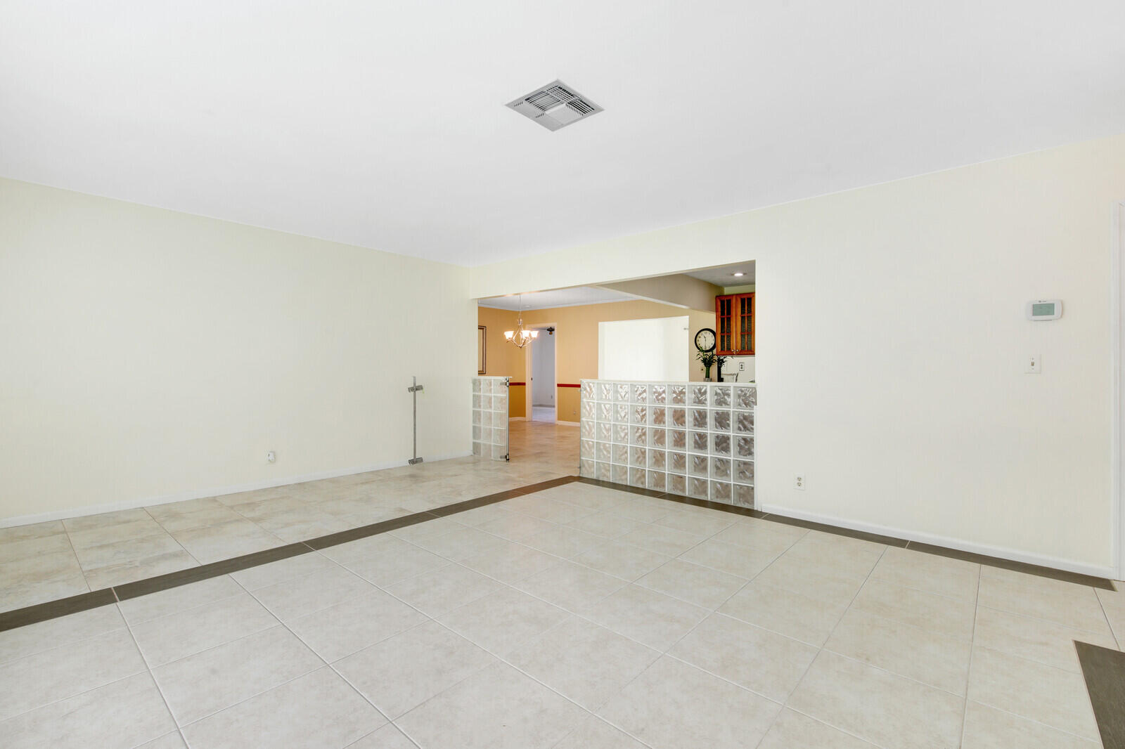 17575 Bridle Court Jupiter, FL 33478 - Photo 7 of 35 an empty room with wooden floor and windows
