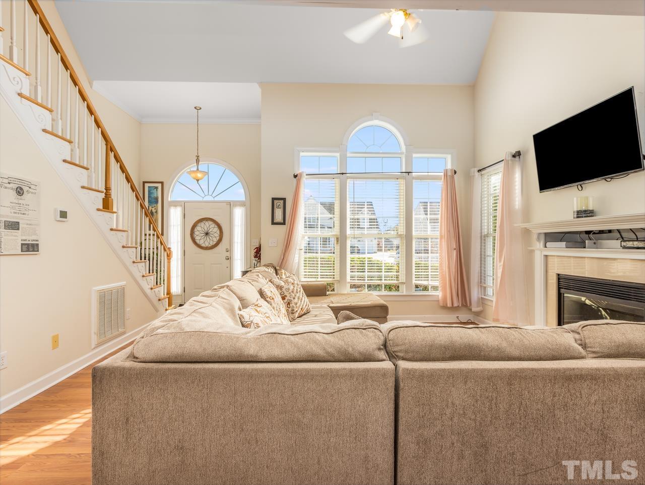 79 Kerrylane Drive Angier, NC 27501 - Photo 12 of 30 a living room with furniture and a flat screen tv