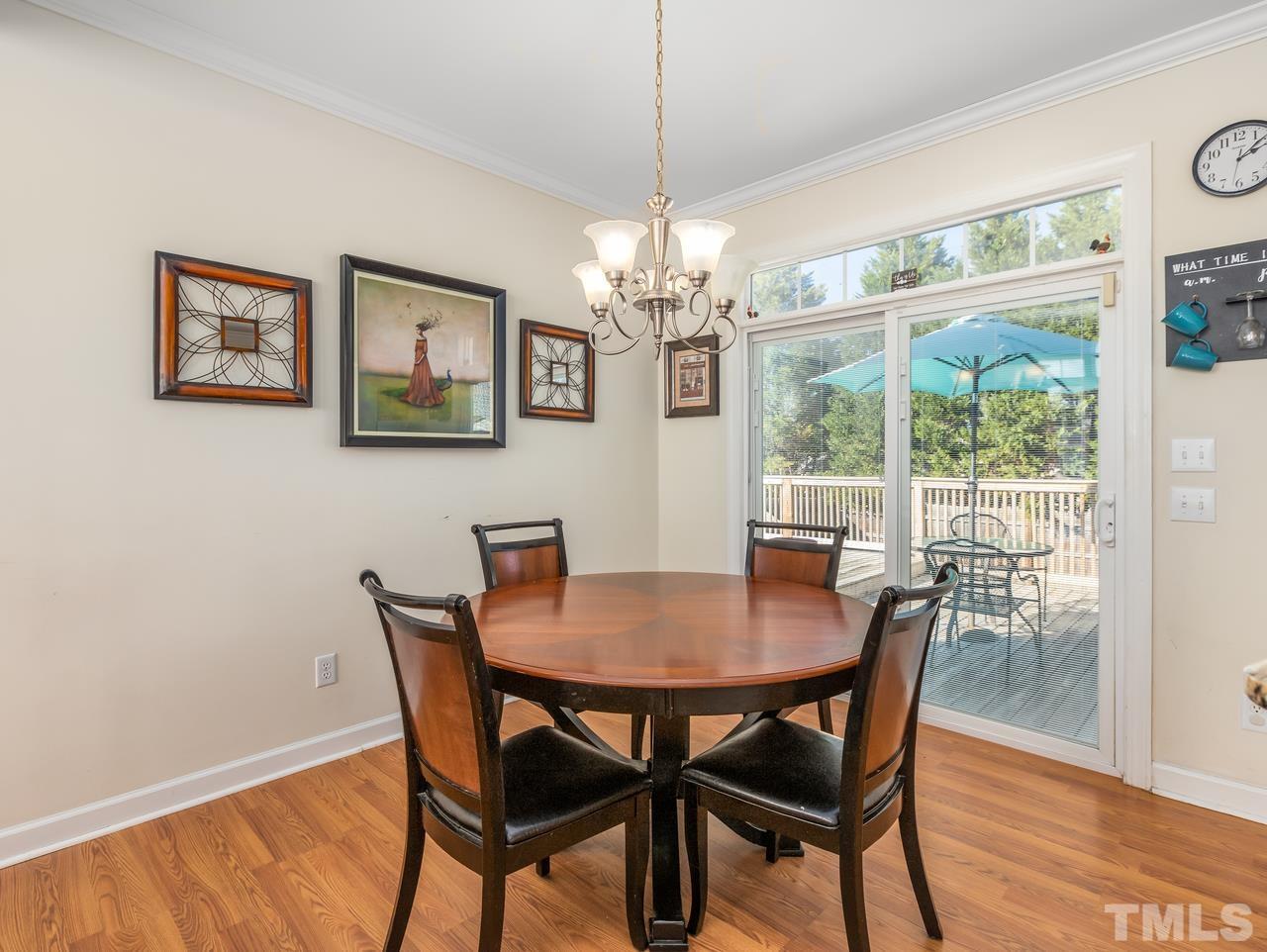 79 Kerrylane Drive Angier, NC 27501 - Photo 14 of 30 a view of a dining room with furniture window and wooden floor