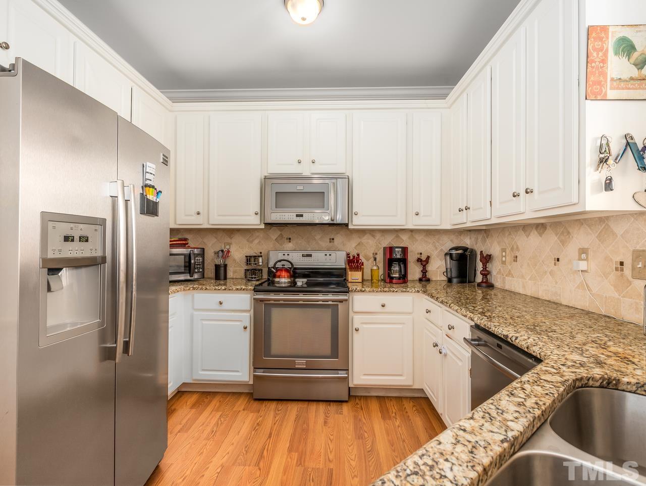 79 Kerrylane Drive Angier, NC 27501 - Photo 15 of 30 a kitchen with a refrigerator sink and cabinets