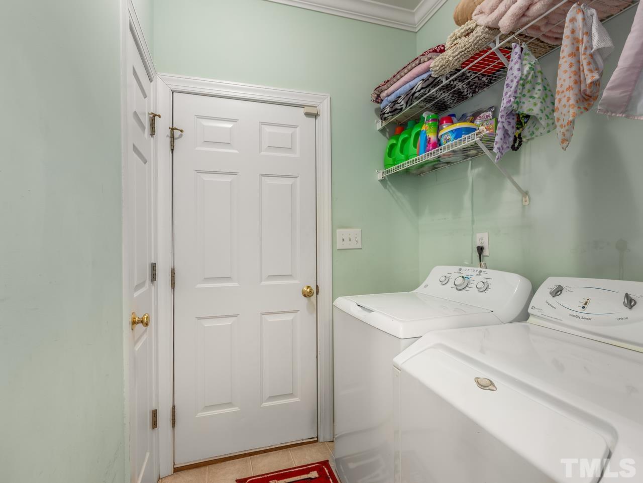 79 Kerrylane Drive Angier, NC 27501 - Photo 17 of 30 a utility room with dryer and washer