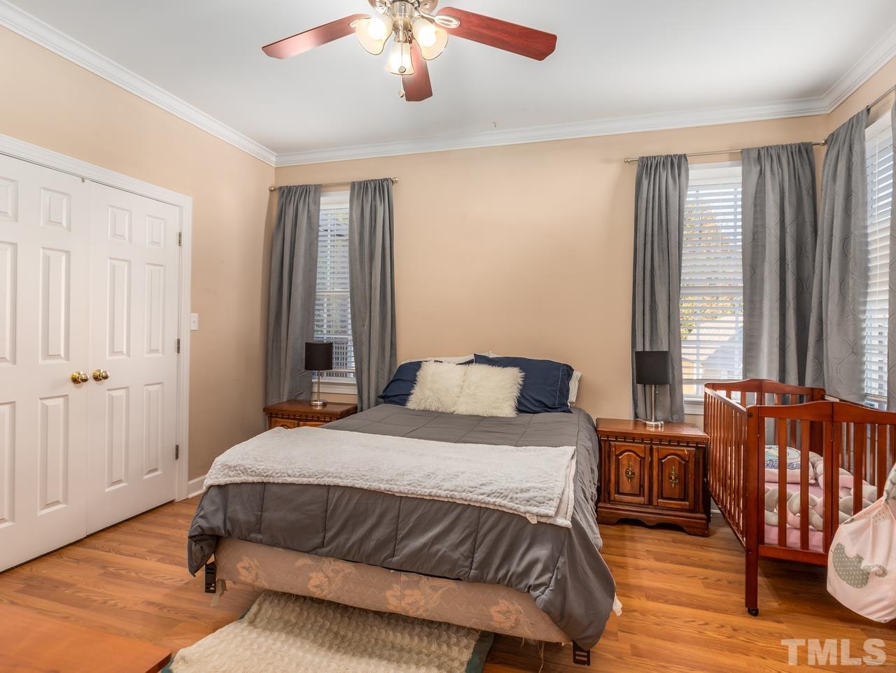 79 Kerrylane Drive Angier, NC 27501 - Photo 20 of 30 a bedroom with a bed and wooden floor