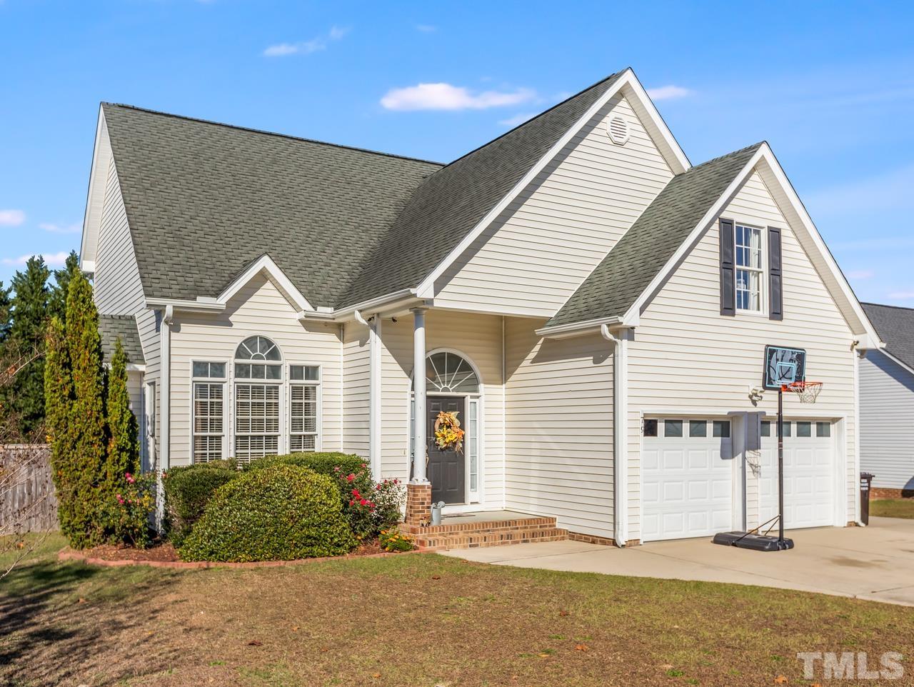 79 Kerrylane Drive Angier, NC 27501 - Photo 3 of 30 a front view of a house with a yard