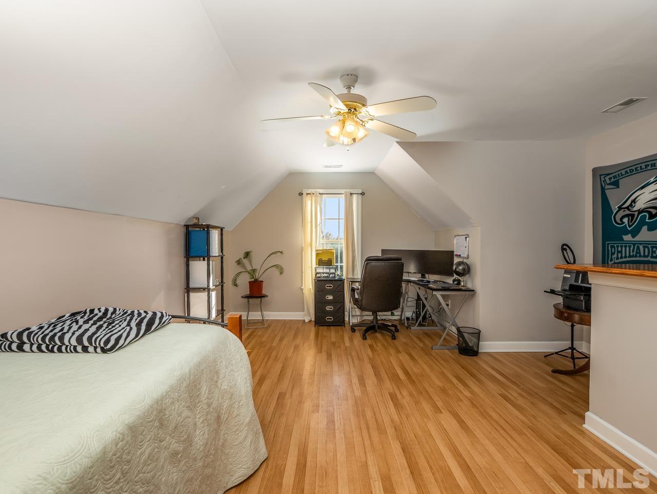 79 Kerrylane Drive Angier, NC 27501 - Photo 28 of 30 a bedroom with a bed and wooden floor